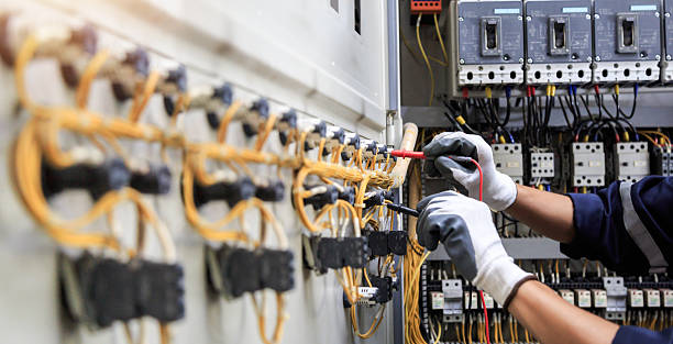 Professional Electrician technician working in Pinehurst, MA